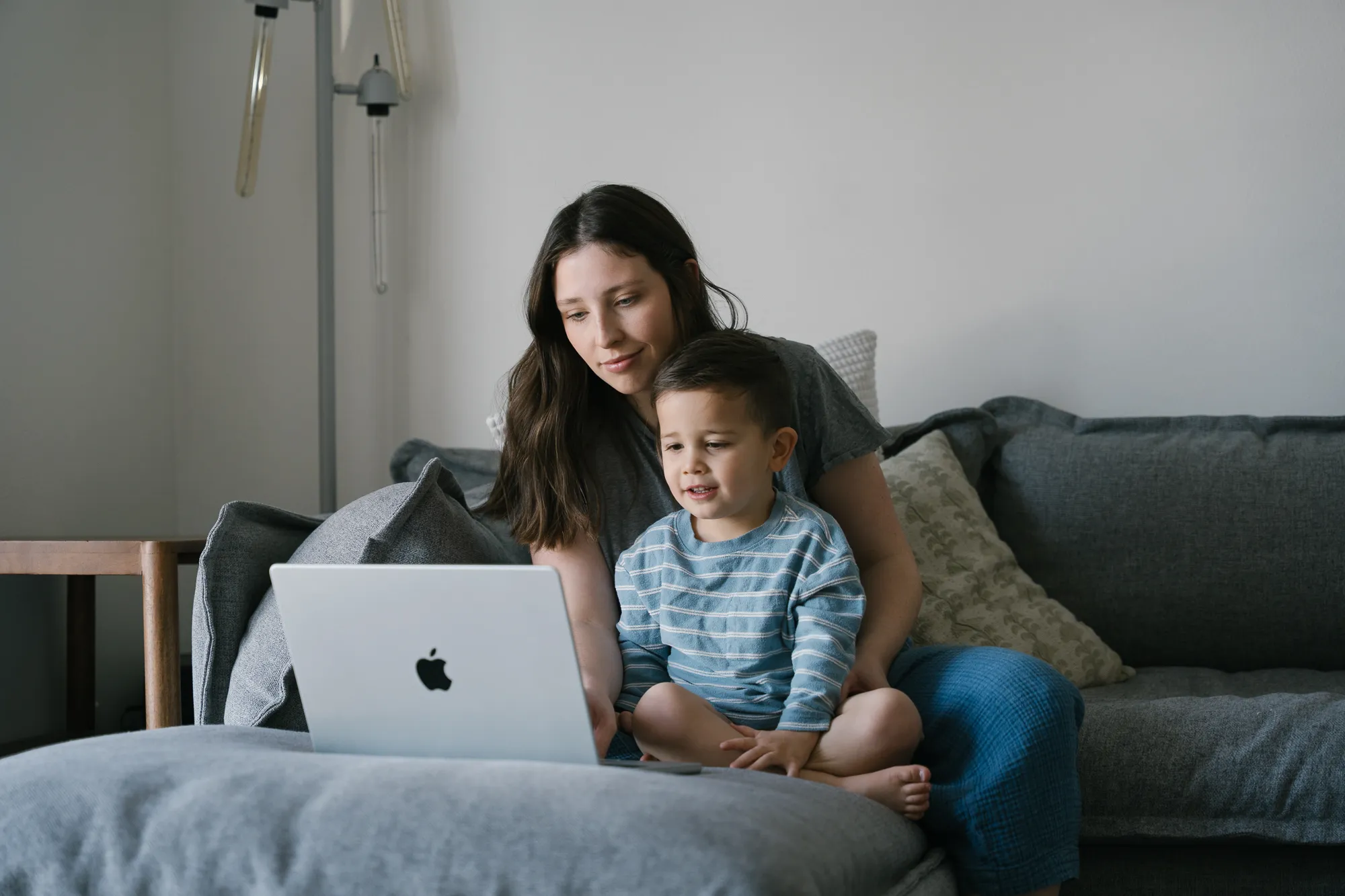 Mom with child studying in the living room